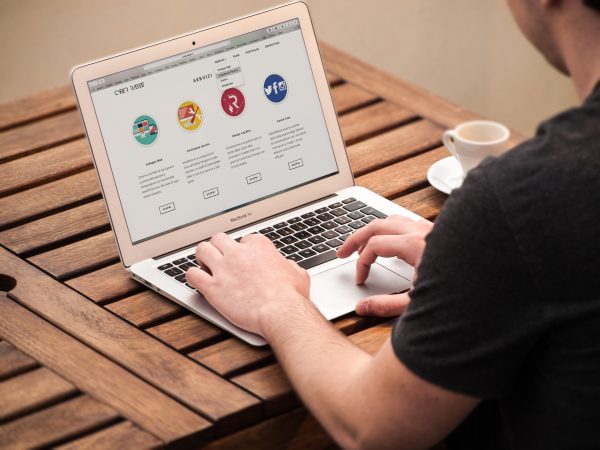 a man browsing the web before hiring a moving company